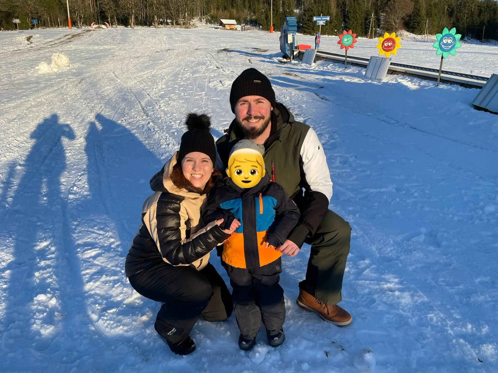 A picture of my family in our winter holidays on a snow slope.